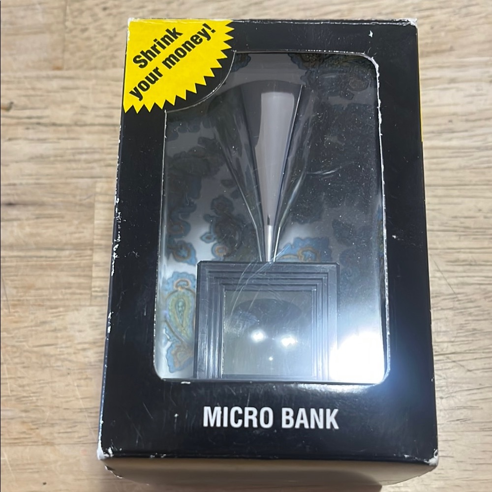 Micro Bank the incredible coin shrinking money box.